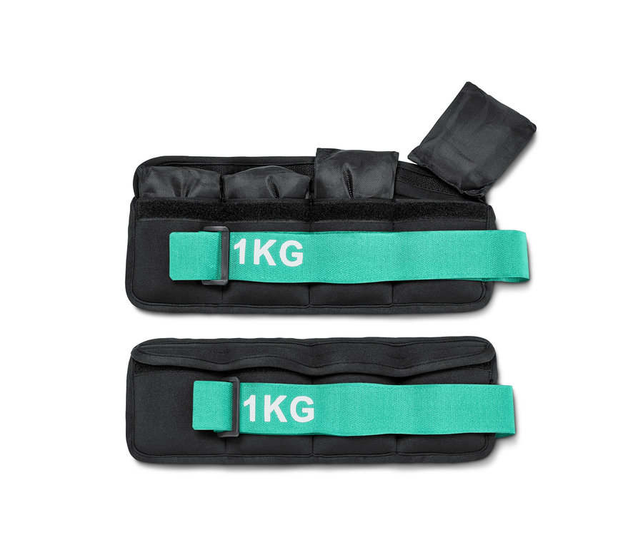 Turkuaz kayışları ve üzerinde 1 kg yazısı olan iki siyah bilek ağırlığı.