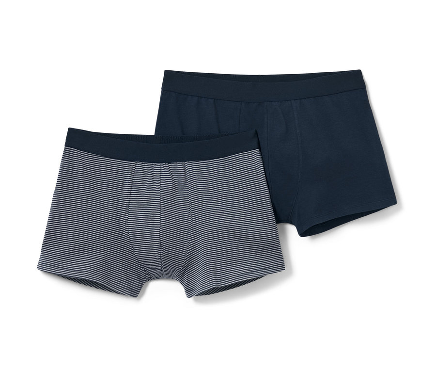 İki adet slip boxer; biri düz mavi, diğeri beyaz çizgili.