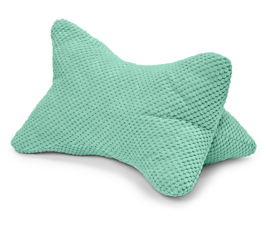 Beyaz bir arka planda nane yeşili bir okuma yastığı duruyor.