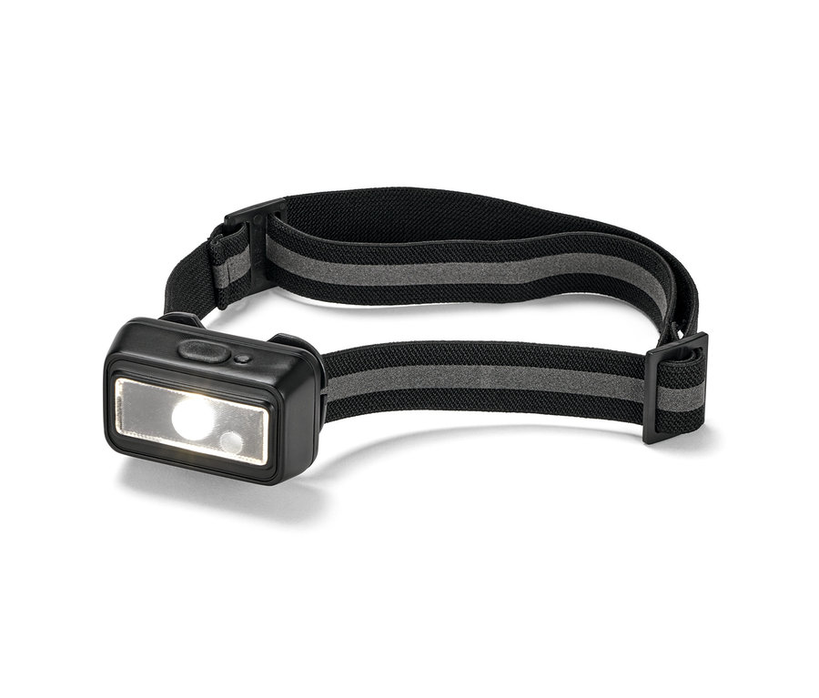 Siyah bantlı ve ışığı yanar durumda olan kompakt bir alın lambasının yakın çekimi.