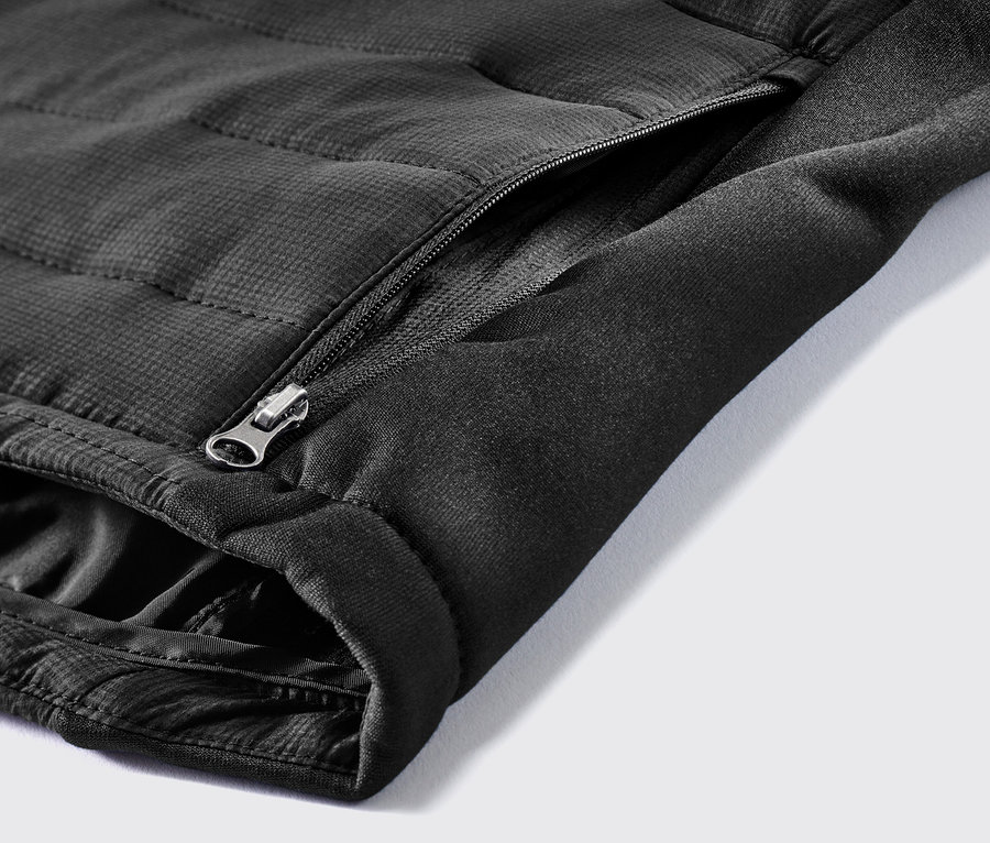 Fermuarlı cepli termal kapitone yelek detayı.