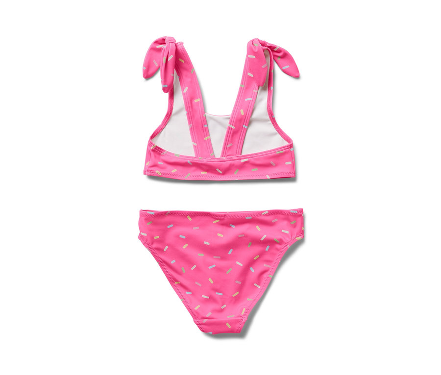 Renkli serpme desenli pembe çocuk bikinisi.