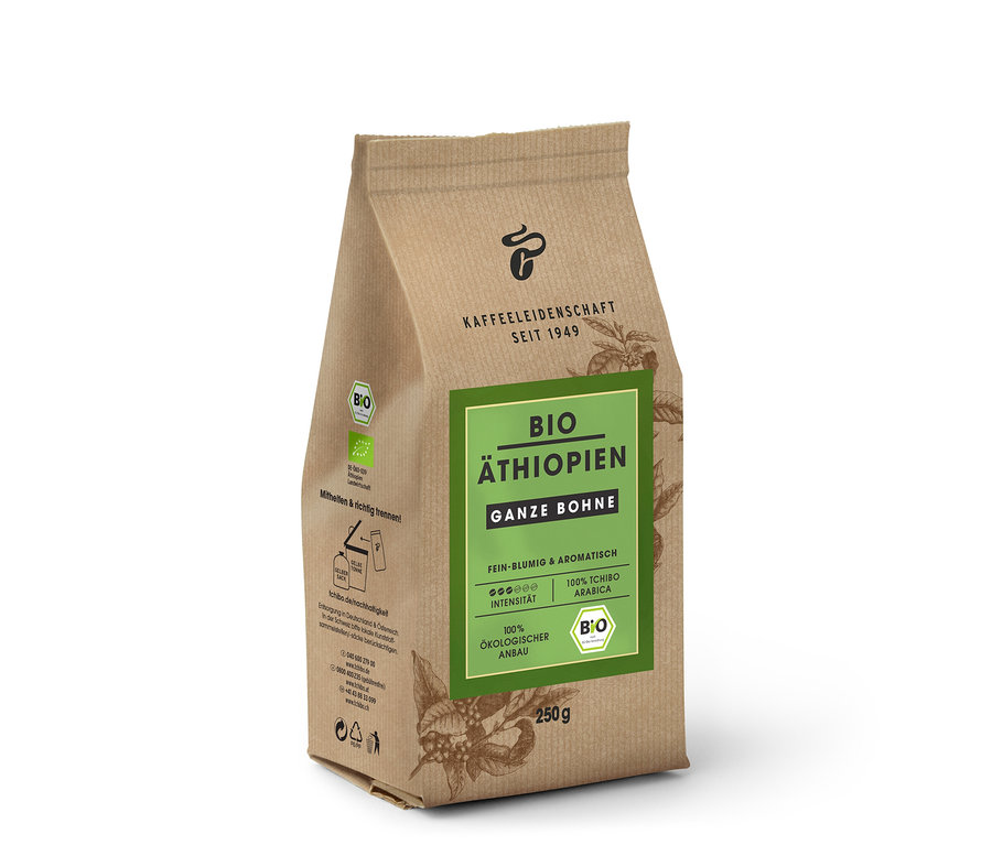 Bir paket Organik Etiyopya - 250 g Çekirdek Kahve dik duruyor. Paket kahverengi ve yeşil bir etikete sahip.