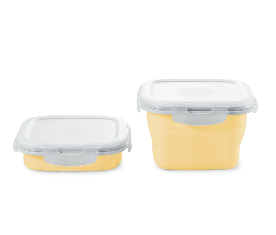 Beyaz kapaklı iki adet sarı katlanabilir saklama kutusu.