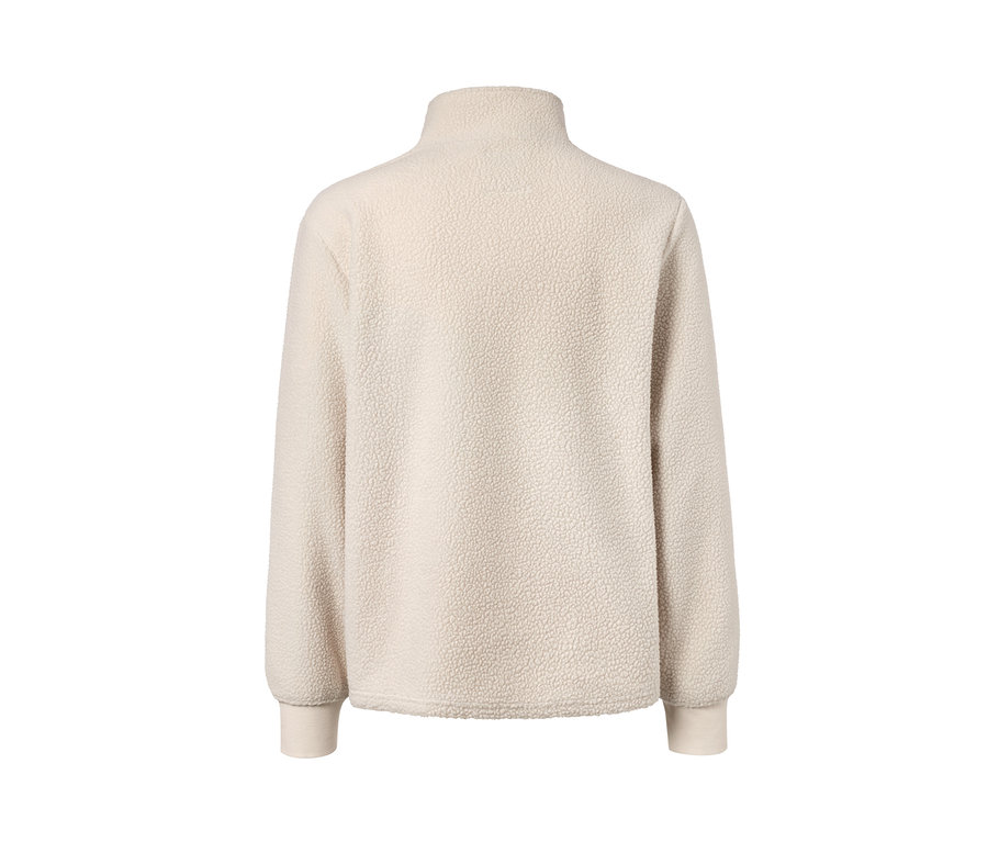 Kum rengi polar kazağın yakın çekim görüntüsü.