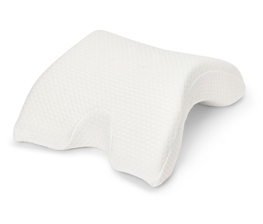 Beyaz bir arka plan üzerinde beyaz ortopedik yastık.