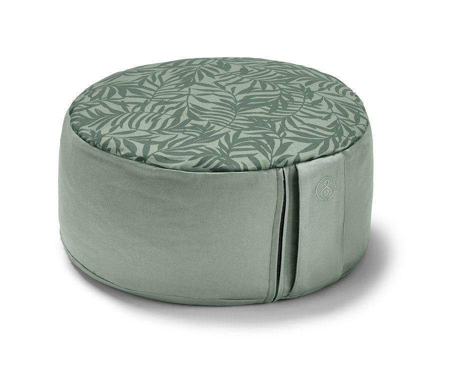 Yaprak desenli, yeşil renkli meditasyon minderi.