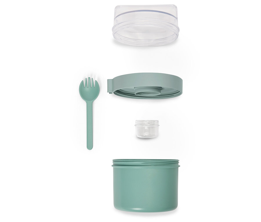 Çatal ve şeffaf kapaklı, demonte edilmiş yeşil yemek kabı.