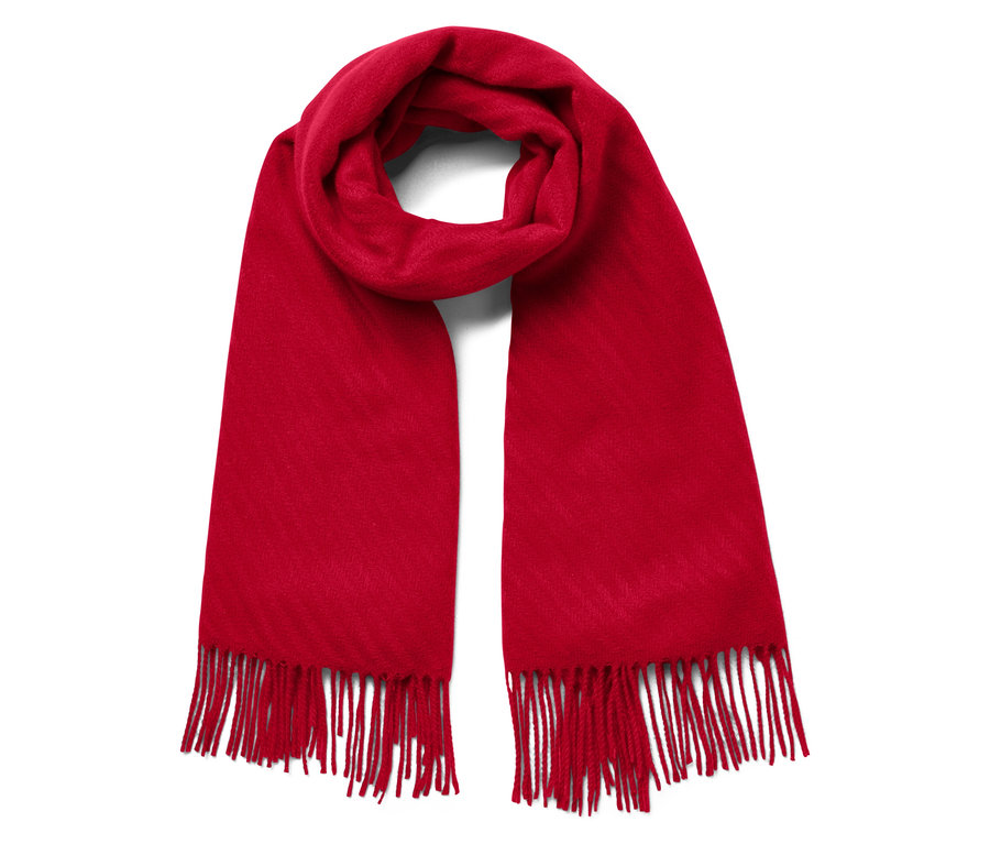 Beyaz arka planda kırmızı, püsküllü bir eşarp.