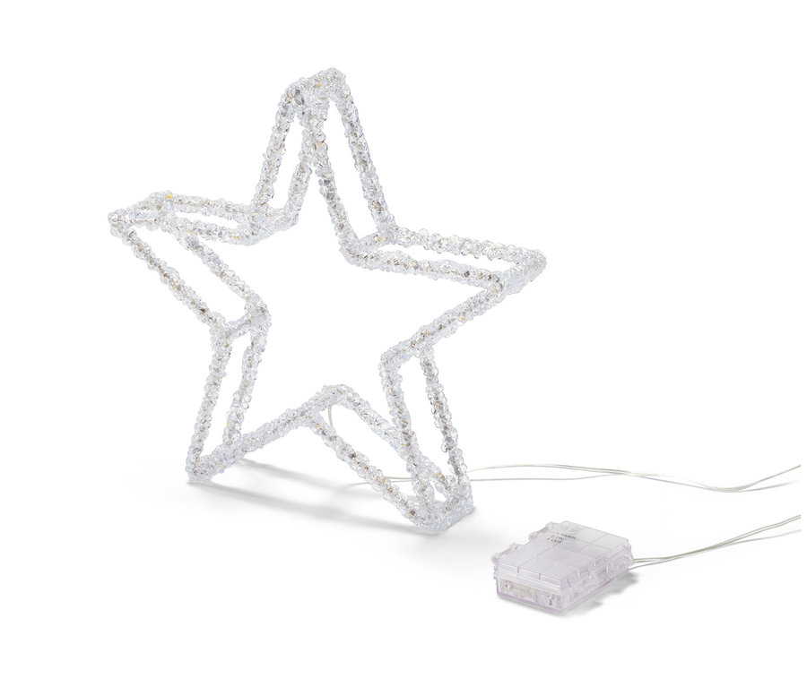 LED'li dekoratif yıldız beyaz bir zeminde duruyor.
