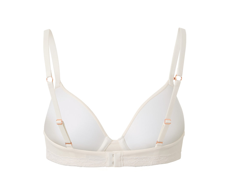 Ayarlanabilir askılı ve kancalı kapamalı krem rengi bir Tişört Sütyen'in yakın çekim görüntüsü.