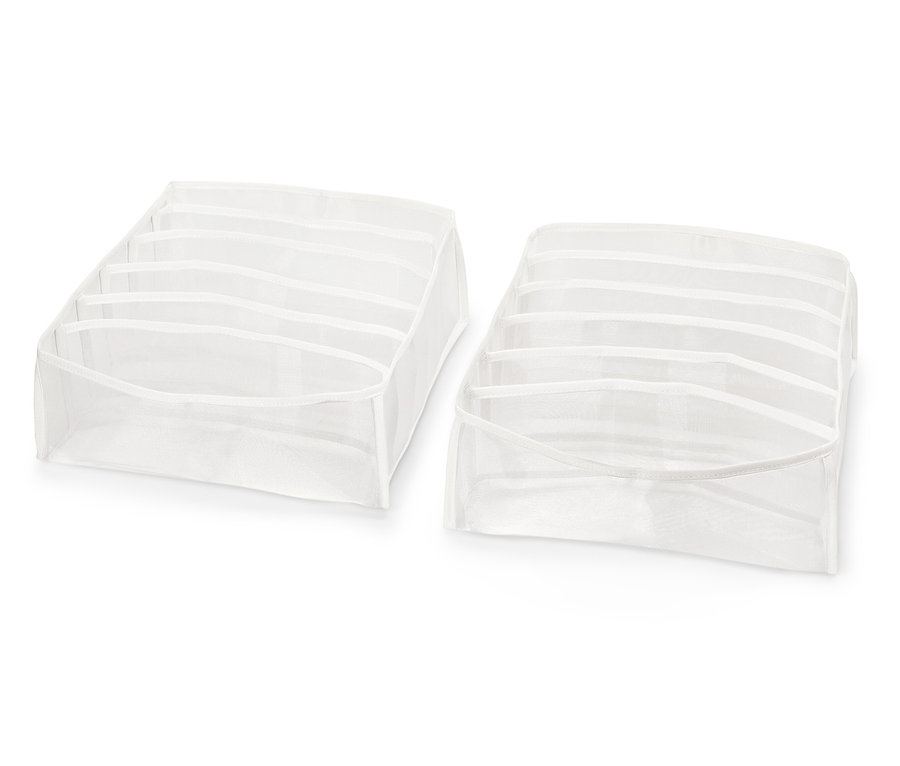 Beyaz bir arka plan üzerinde bölmeleri olan iki beyaz çekmece düzenleyici.