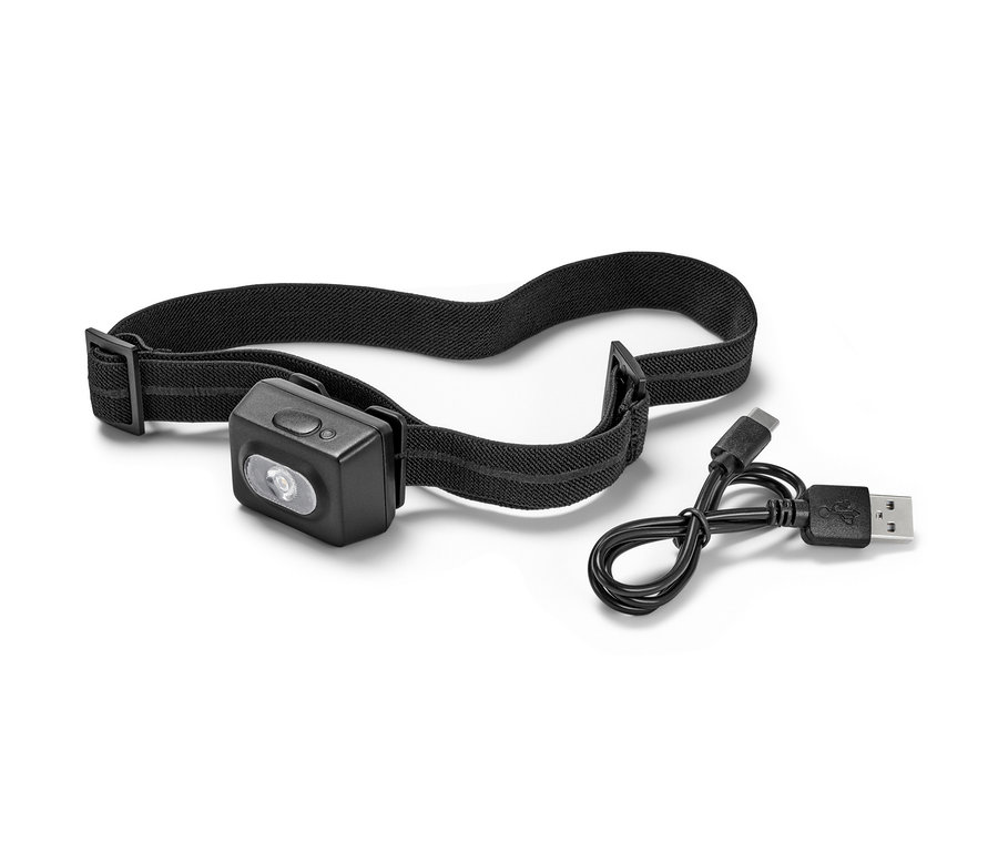 Beyaz bir arka planda siyah kompakt bir alın lambası ve şarj kablosu.