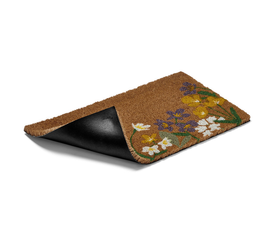 Çiçek desenli kahverengi bir Hindistan cevizi paspası