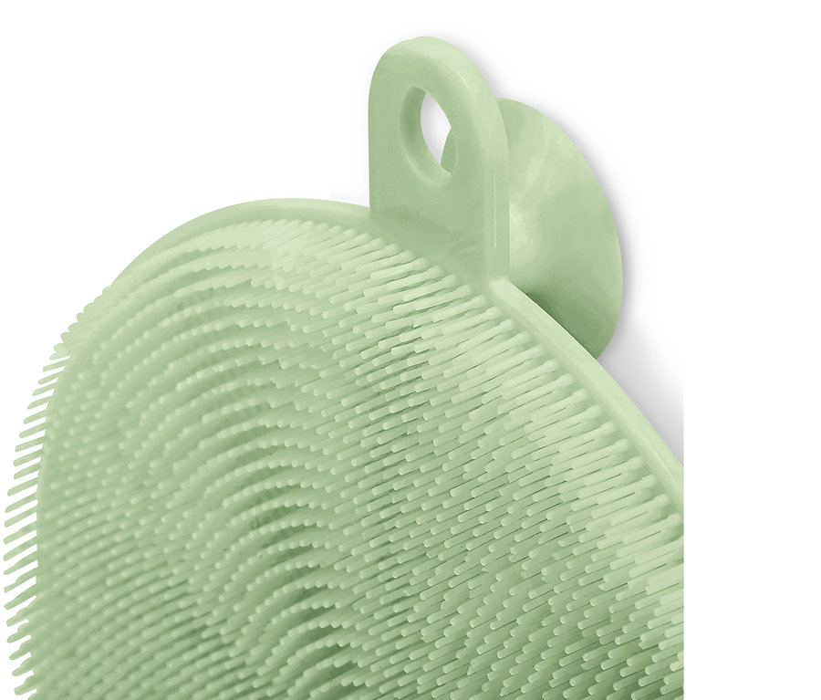 Açık yeşil silikon bulaşık pedinin yakın çekimi.