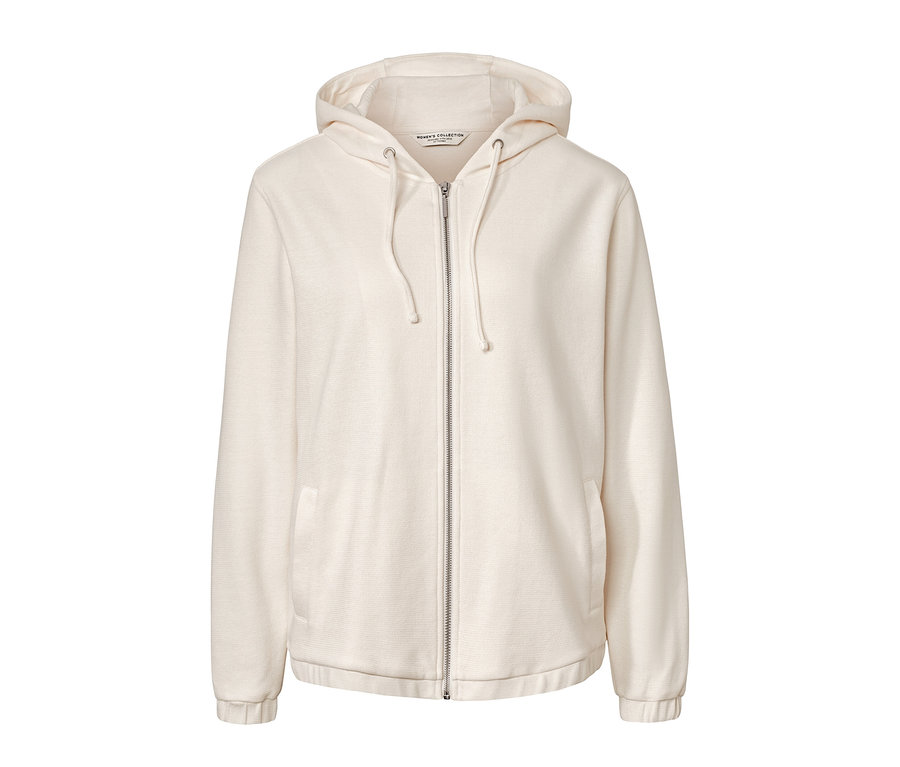 Krem rengi, kapüşonlu, ortasında fermuar bulunan sweatshirt.