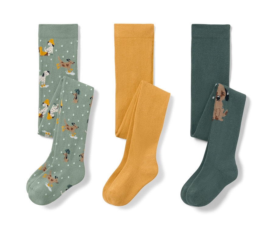Üç adet çocuk külotlu çorap: köpek desenli açık yeşil, sarı ve köpek resimli koyu yeşil.