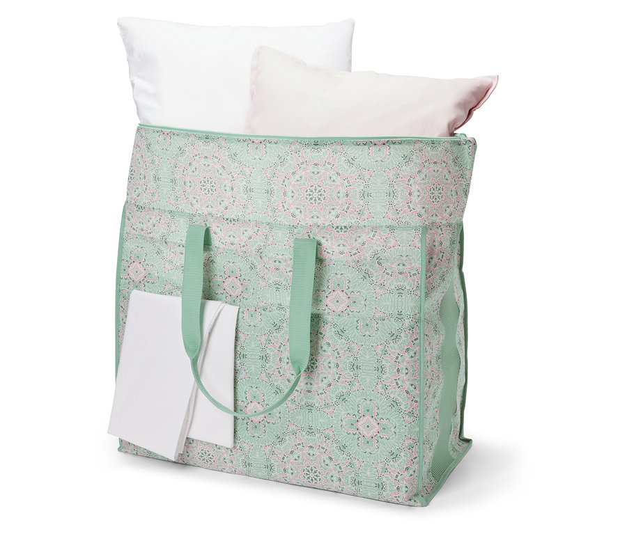 Beyaz ve pembe yastıklı jumbo yatak saklama çantası.