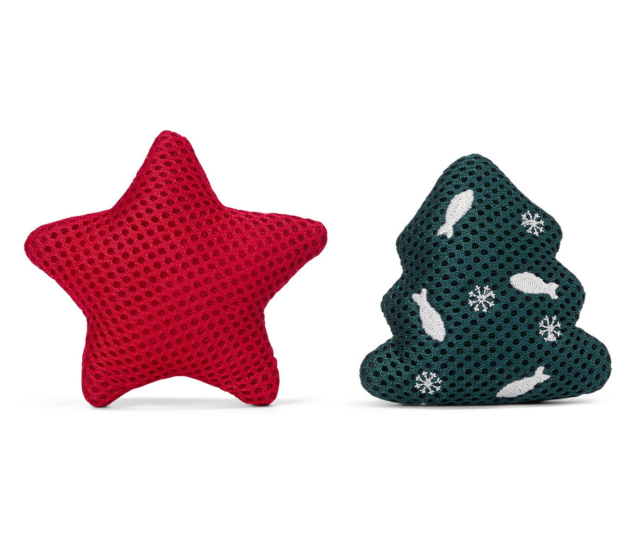 Kırmızı bir yıldız ve yeşil bir Noel ağacı yan yana duruyor.