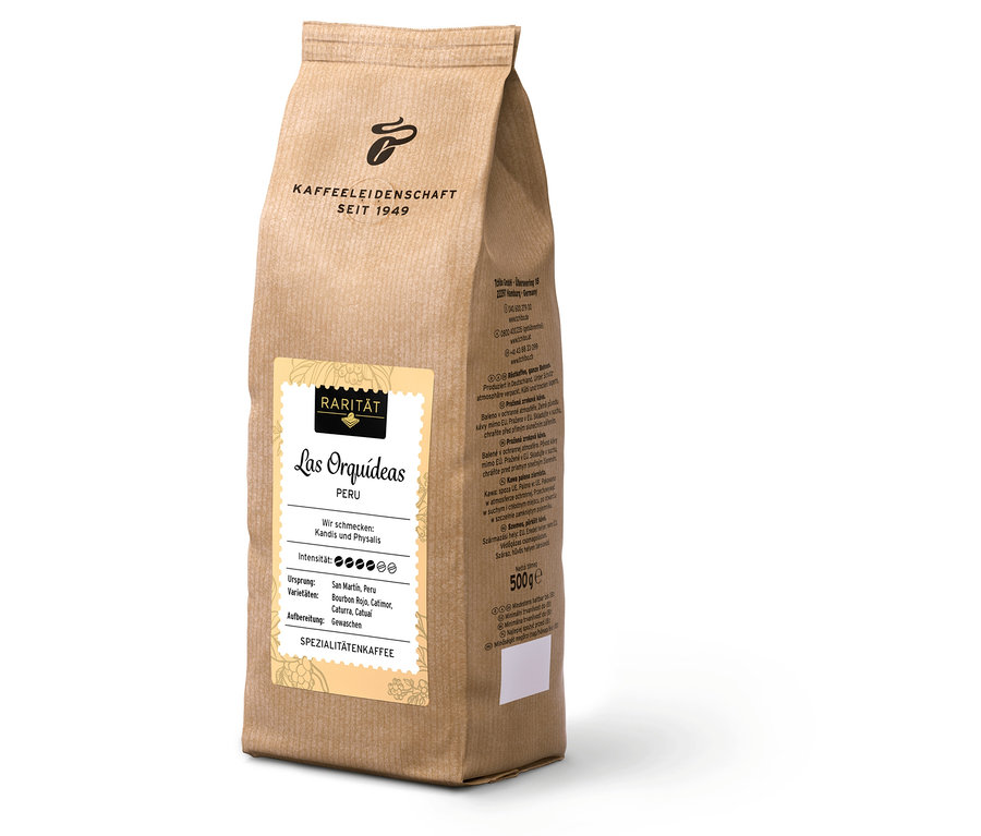 Beyaz bir yüzey üzerinde 500 g'lık »Las Orquídeas Peru« çekirdek kahve paketi duruyor.