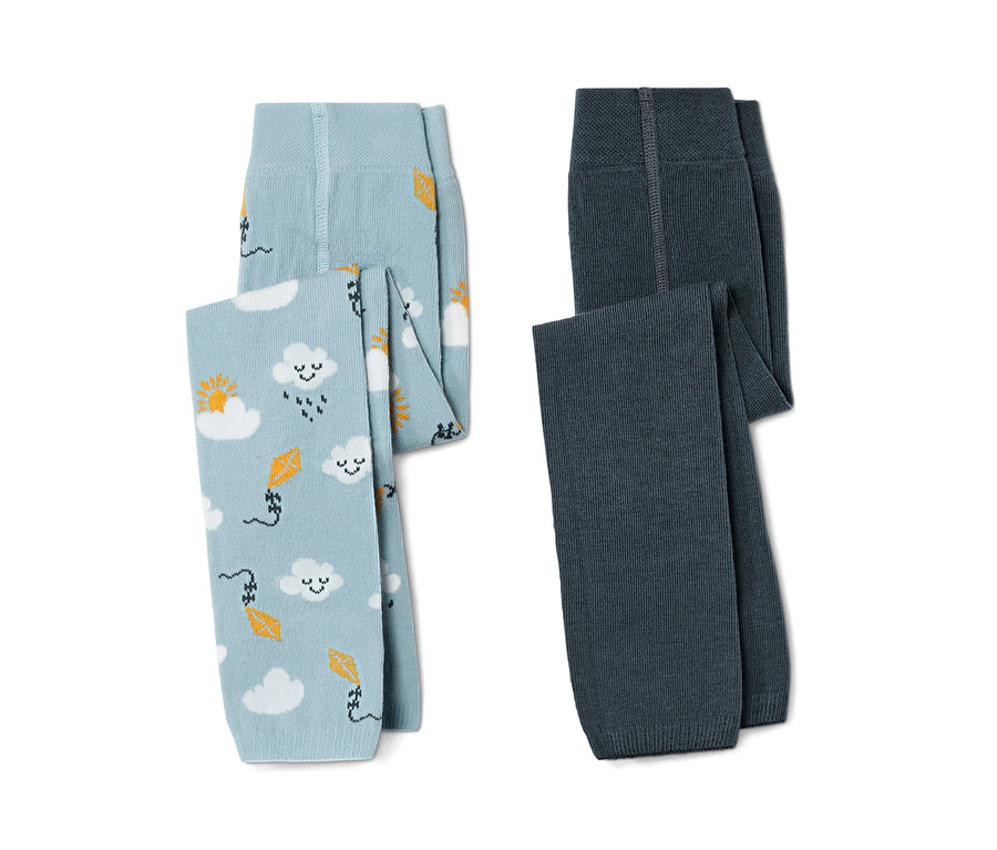 İki adet küçük çocuk örgü tayt, biri bulut ve uçurtma desenli açık mavi, diğeri koyu mavi.