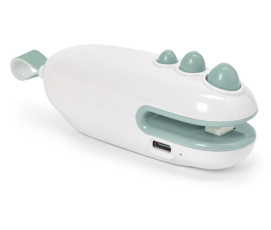 Beyaz ve yeşil renkli elektrikli tırnak törpüsünün yakın çekimi.