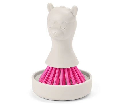 Pembe kıllı gri lama şeklinde fırça, gri bir tutucunun içinde duruyor.