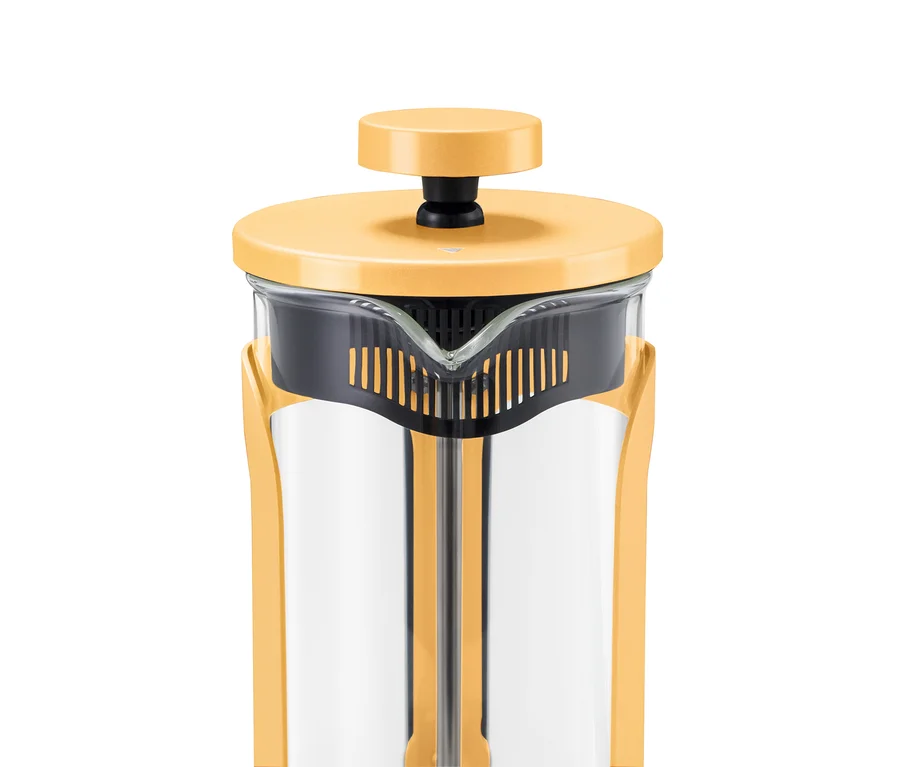 Şeffaf cam gövdeli, sarı kapaklı ve siyah pistonlu sarı bir French press.