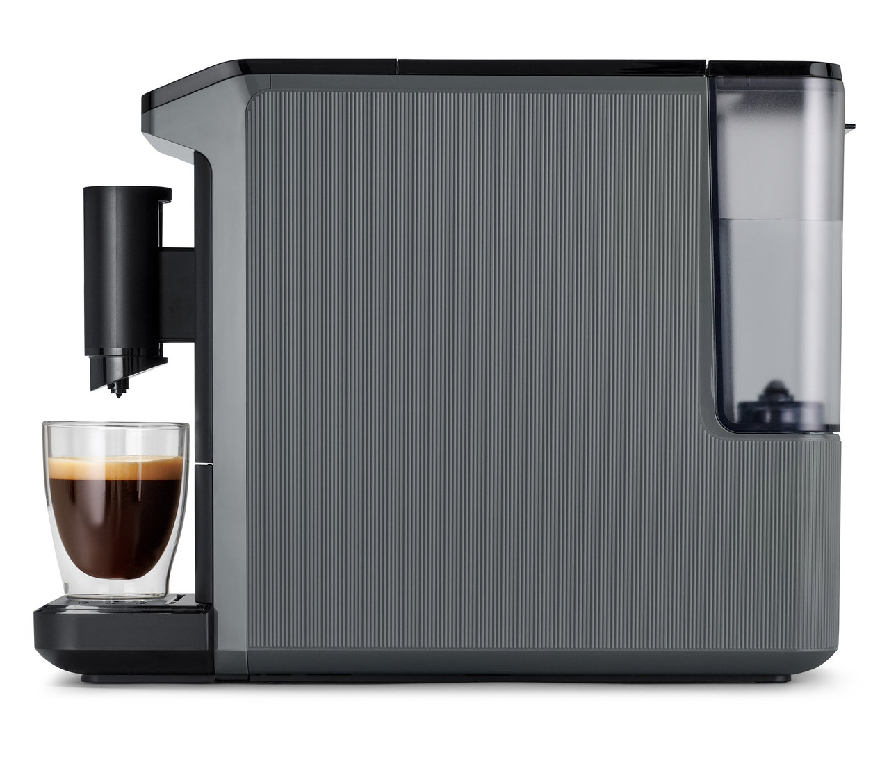 Gri renkli »Esperto mini« kahve makinesi, cam bir bardağa kahve hazırlıyor.