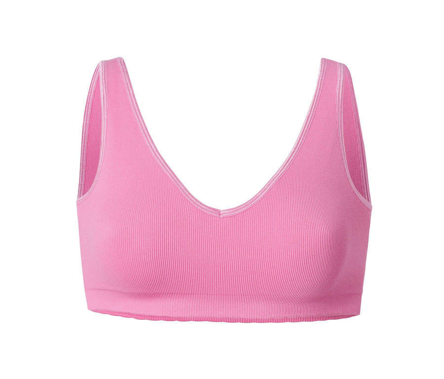 Beyaz arka planda pembe dikişsiz bir büstiyer.