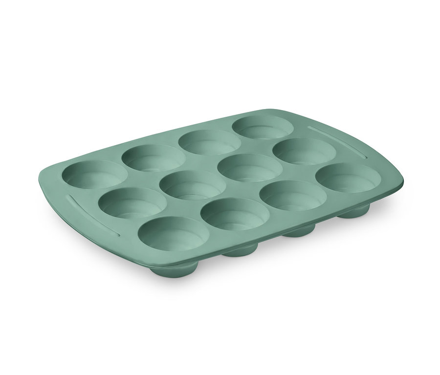 On iki boşluğu olan yeşil silikon muffin kalıbı.