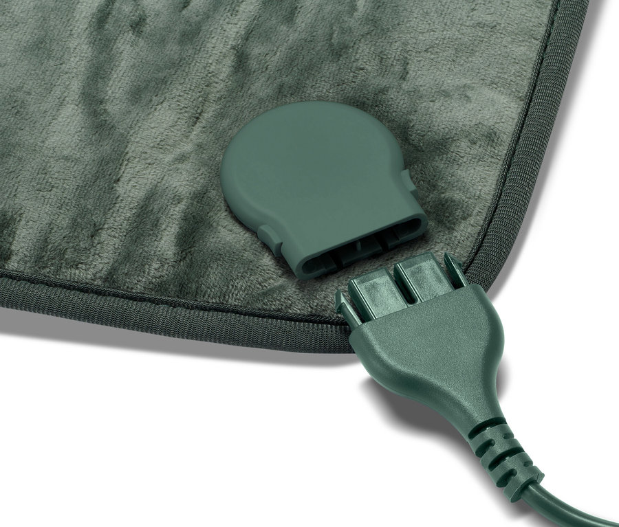 Küçük bir ısıtma minderi ve bağlantısız kablosunun yakın çekimi.