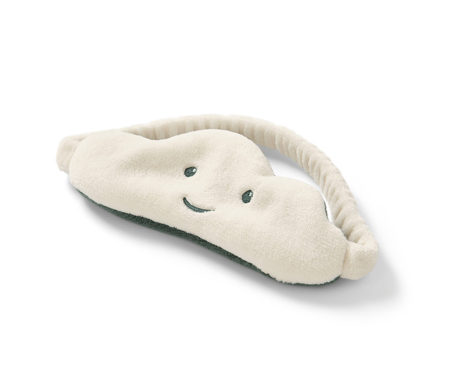 Bulut Uyku Maskesi beyaz bir zeminde duruyor.