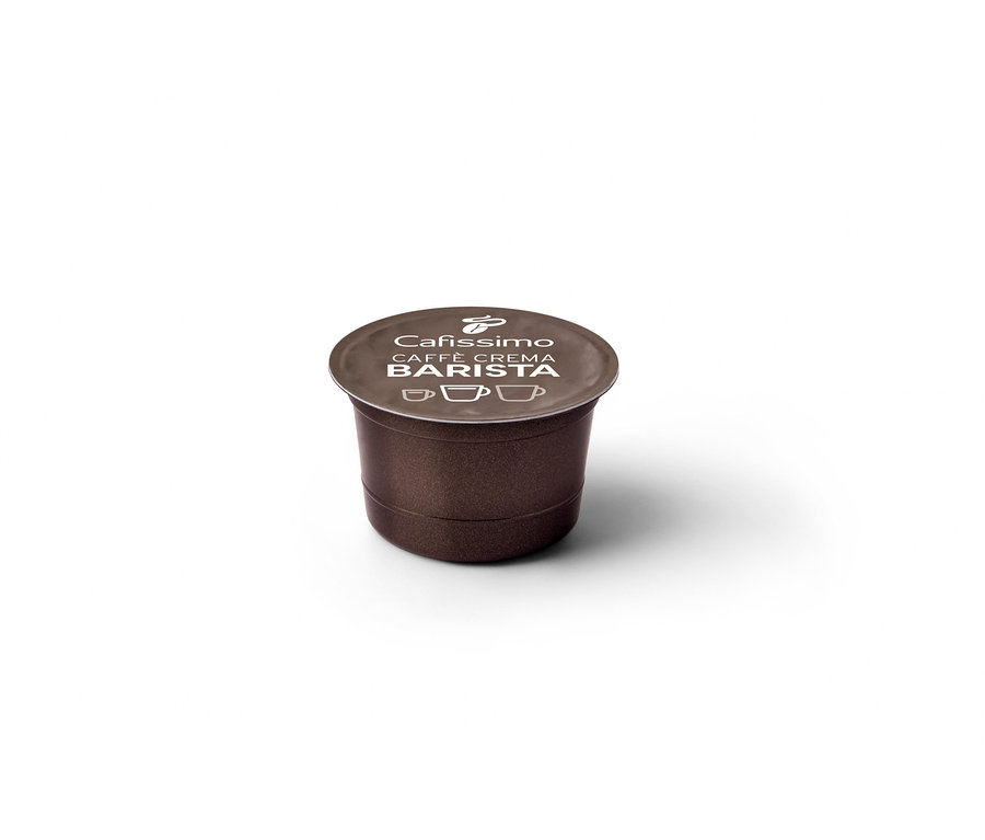 Tek bir kahverengi Barista Edition Caffè Crema kapsülün yakın çekimi.