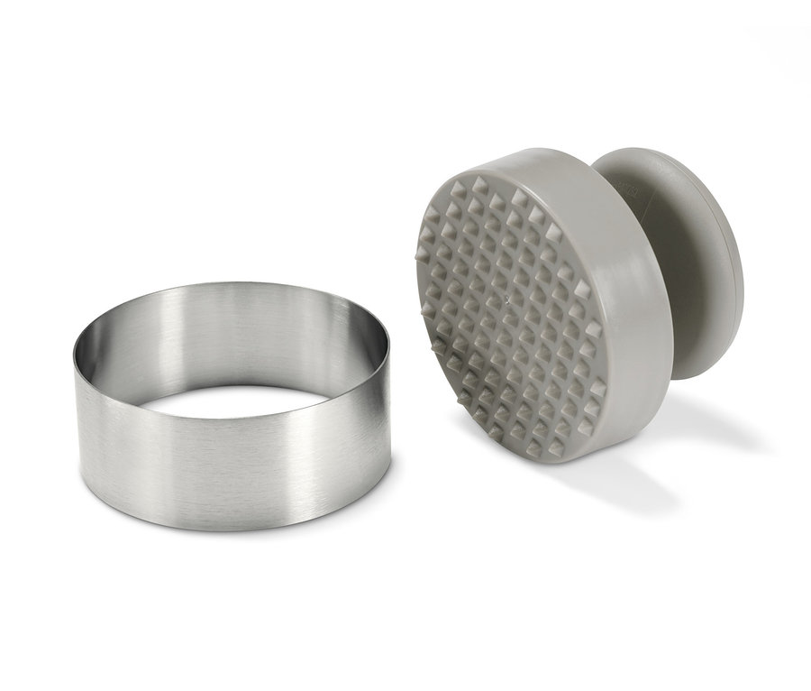 Paslanmaz çelik halka ve gri bir burger presi.