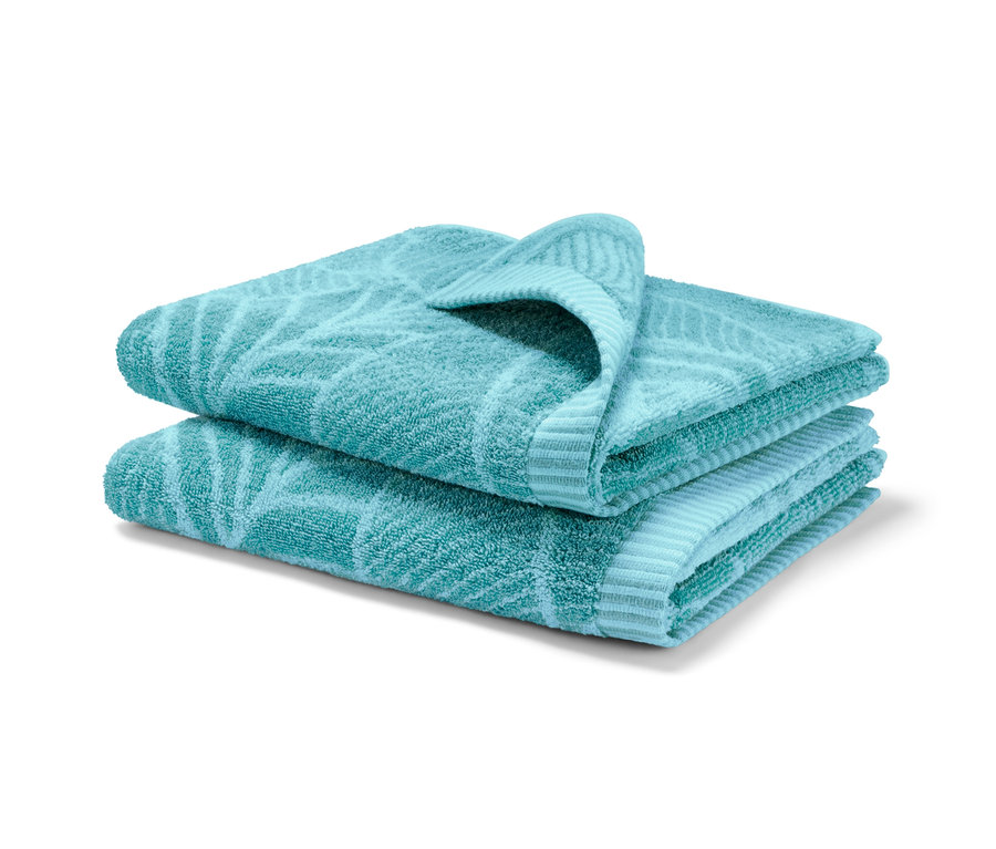 İki adet deniz mavisi jakar el havlusu üst üste katlanmış.