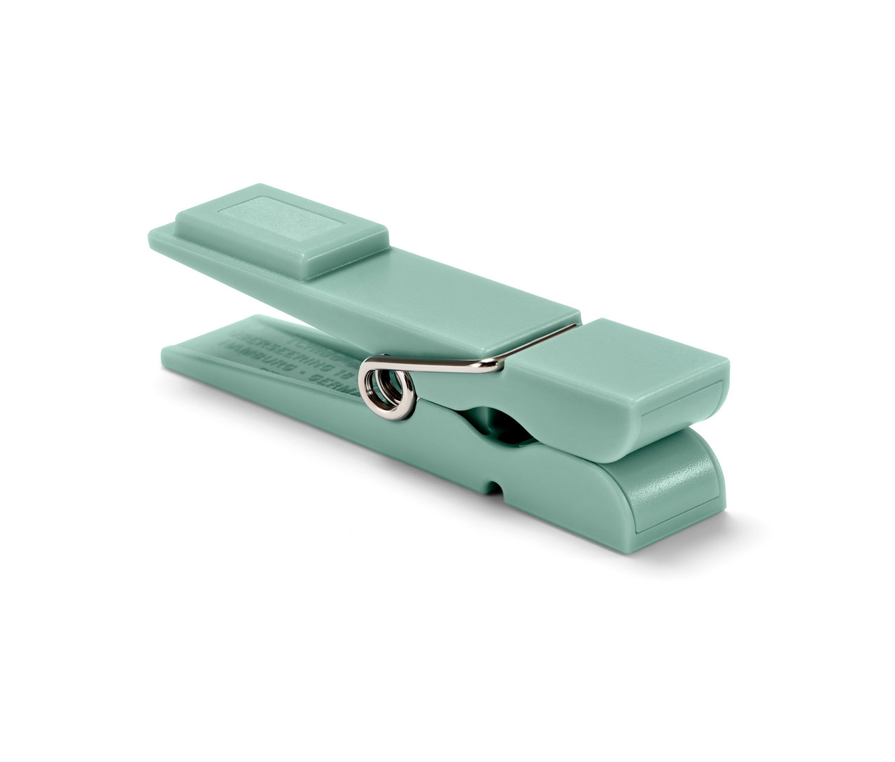 Tek bir açık yeşil buzdolabı mıknatısının yakın çekimi.