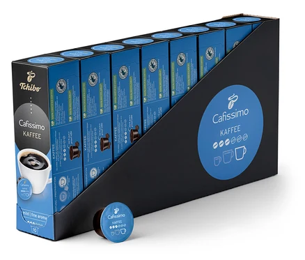 Siyah bir pakette sıralı duran Coffee Fine Aroma Kapsül Filtre Kahve - 80 Kapsül ve paketin önünde bir kapsül bulunuyor.