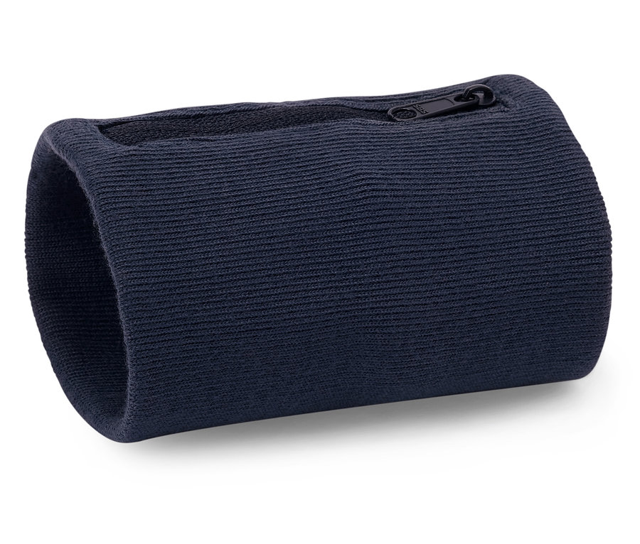 Beyaz bir yüzeyde lacivert, fermuarlı bir bileklik duruyor.